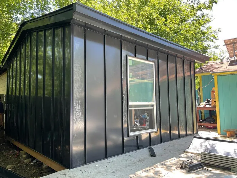 Black standing seam metal wall panels for Roof Inspection in Calera